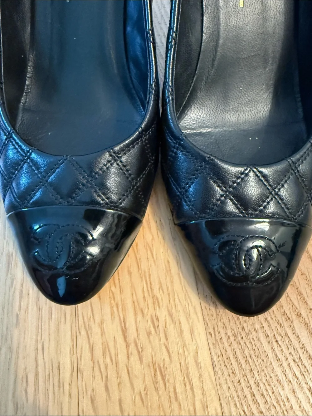 CHANEL Black Quilted Leather Cap-Toe Pumps with Patent CC